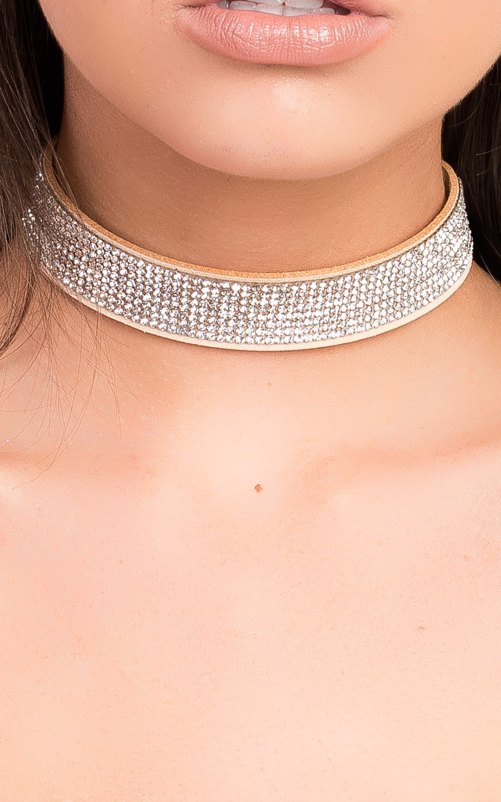 Suede diamante choker by Clarizzma featuring sparkling rhinestones on a soft suede band. A glamorous accessory perfect for evening wear and special occasions.