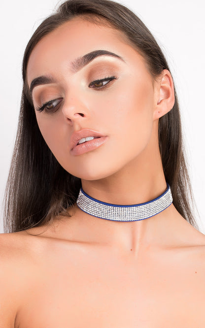 Suede Diamante Choker by Clarizzma, featuring sparkling rhinestones on a soft suede band. A glamorous accessory perfect for evening wear.