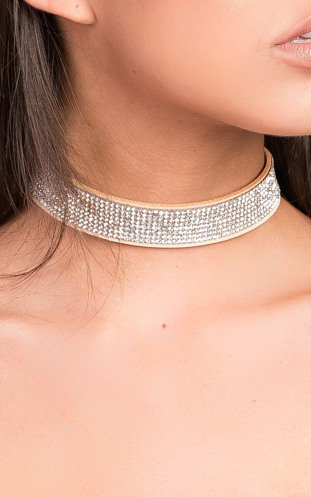 Suede Diamante Choker by Clarizzma featuring sparkling rhinestones on a soft suede band. Perfect for elevating evening outfits with a glamorous touch.