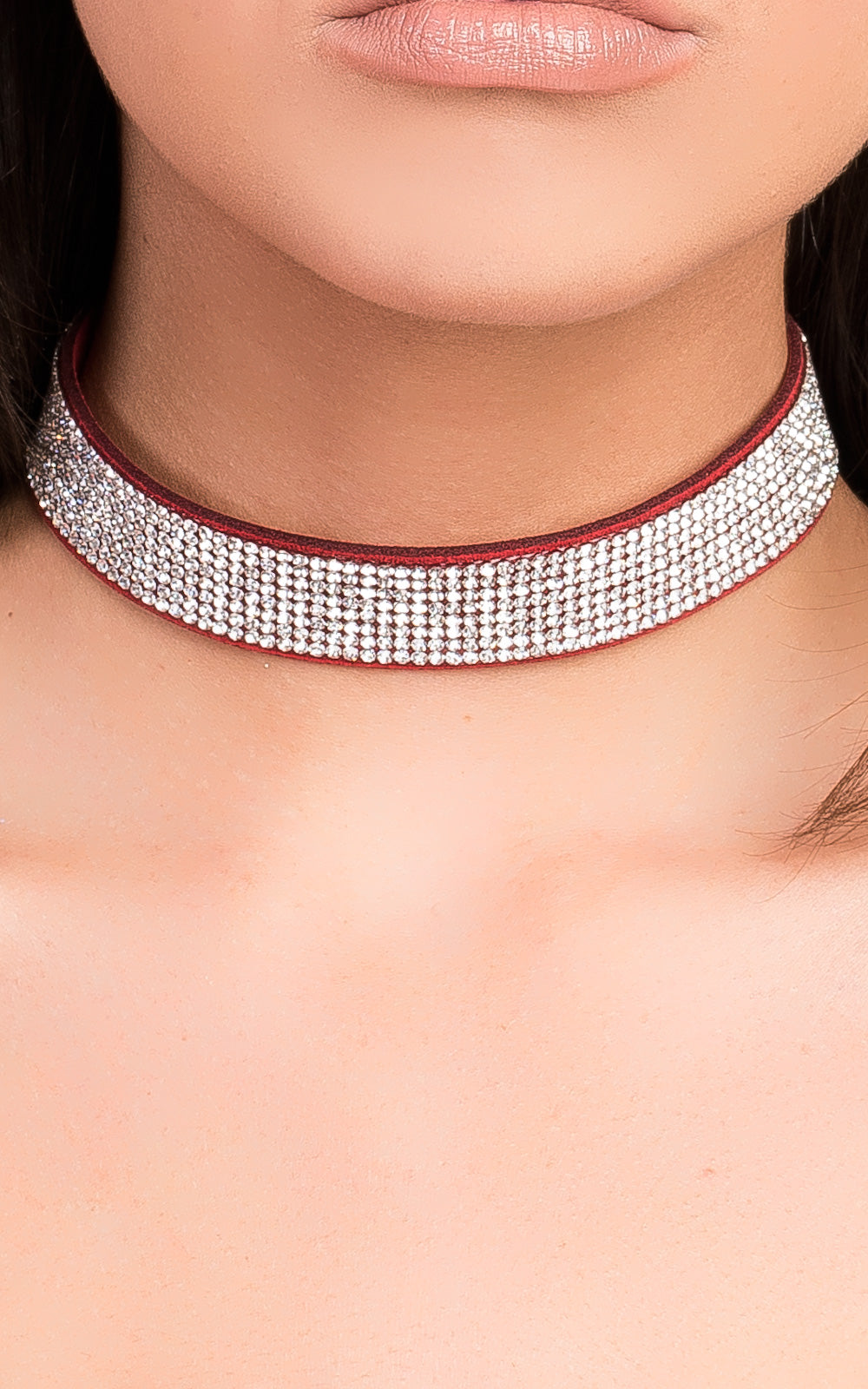 Suede Diamante Choker by Clarizzma, featuring sparkling rhinestones on a soft suede band. A glamorous accessory perfect for evening wear.