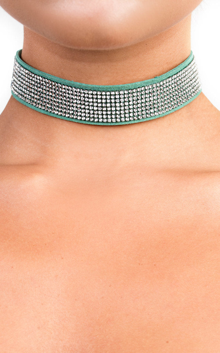 Suede Diamante Choker by Clarizzma featuring a sparkling rhinestone design on a soft suede band. Perfect for adding glamour to any outfit.